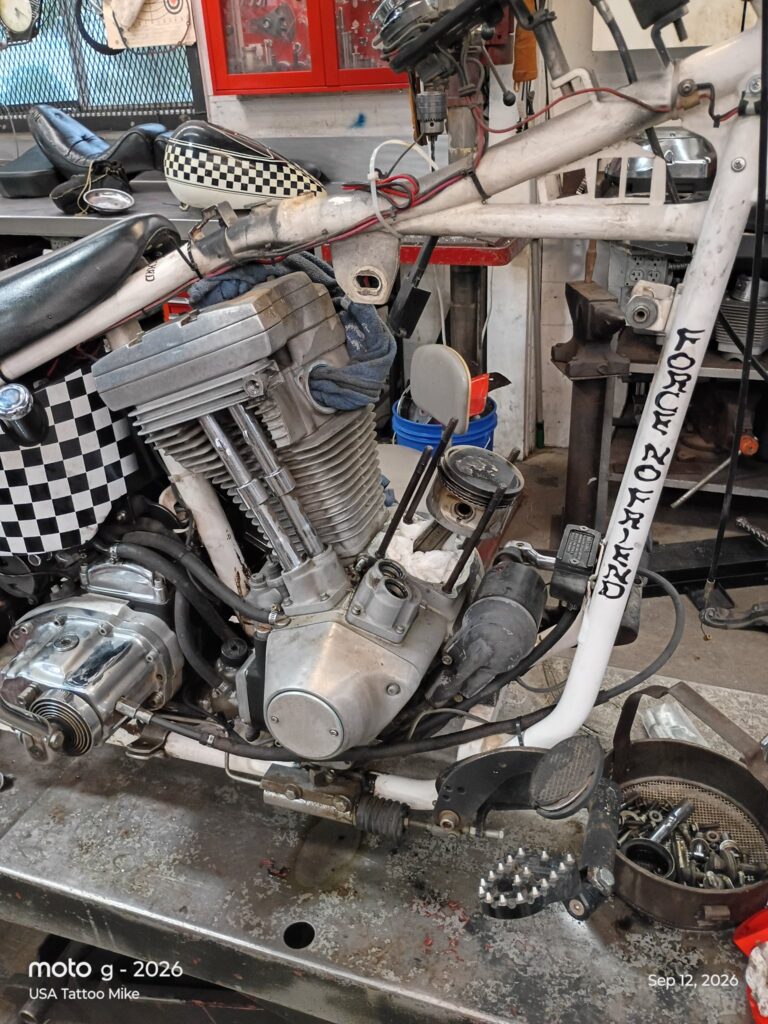 Piston on the connecting rod with the cylinder removed for a base gasket change